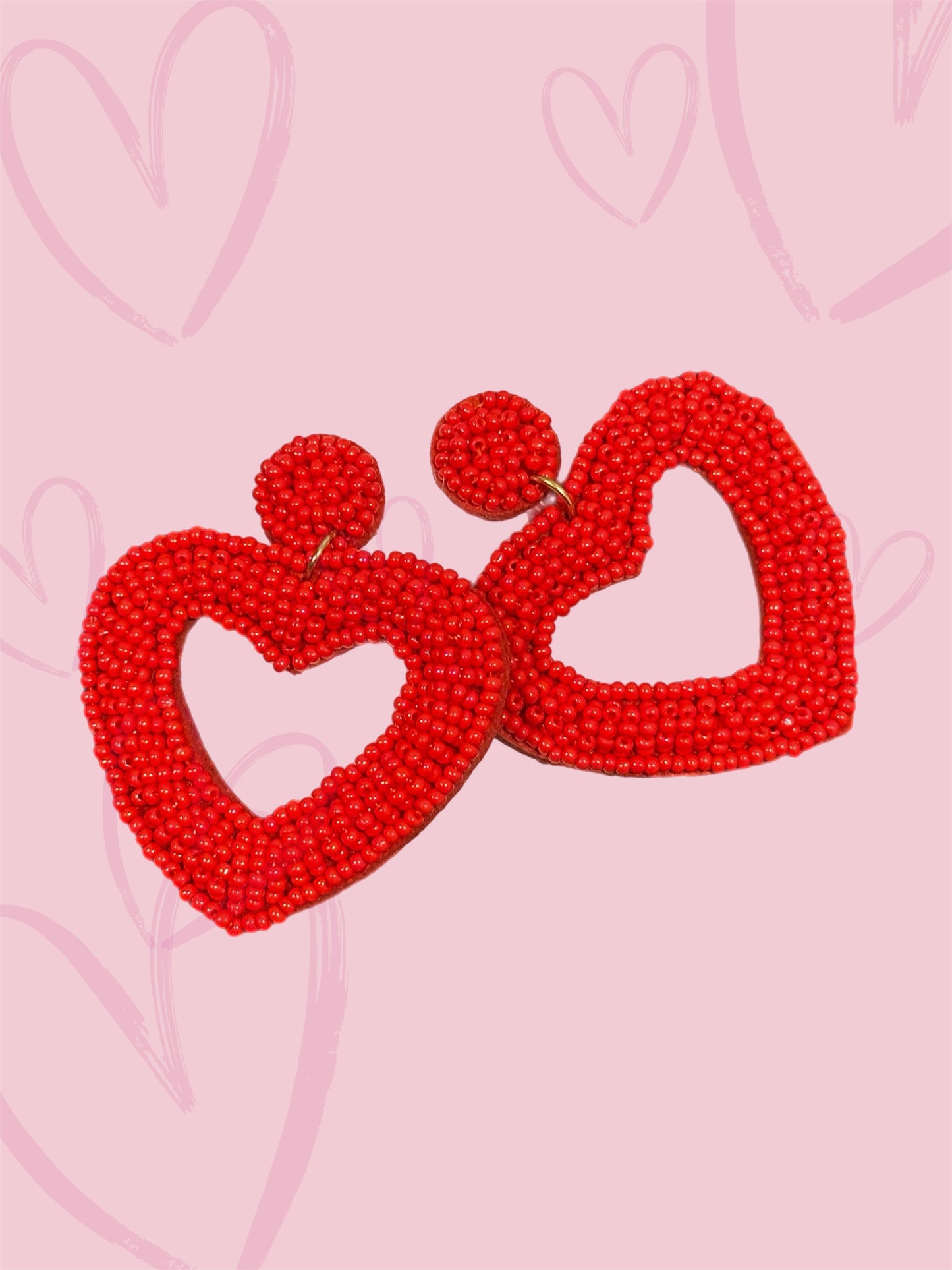 Open red heart beaded earrings